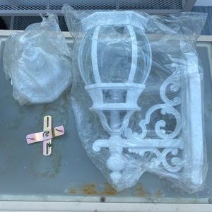 Out door mounting light brand new still in plastic. Asking $30.